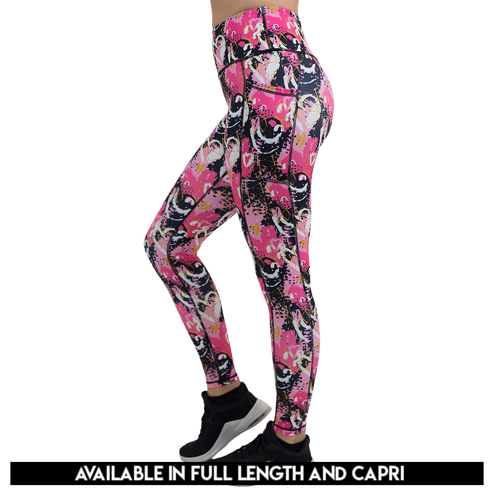 available lengths for the white hearts against a bold pink, black, and yellow pattern leggings, lengths available include full length and capri