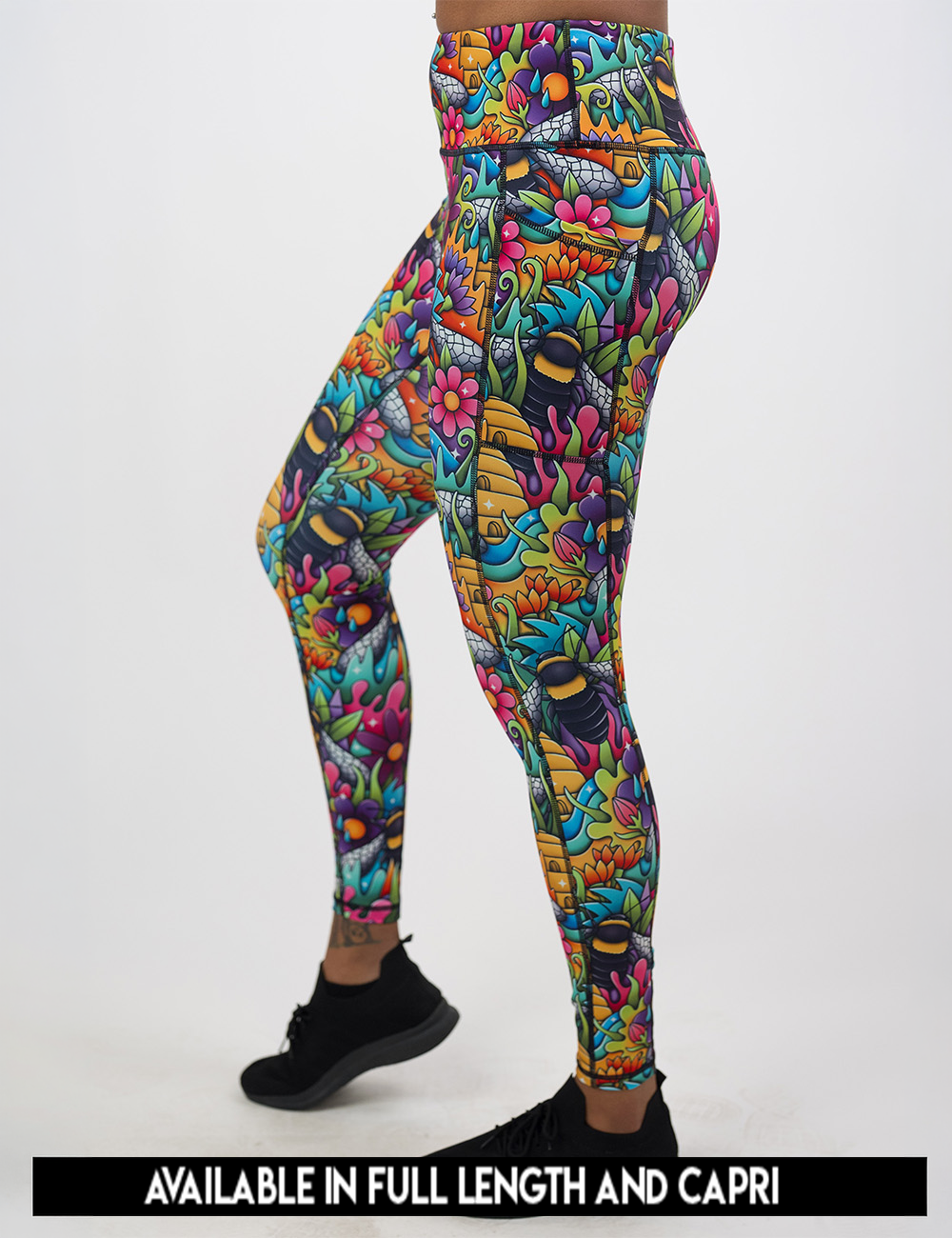 available lengths for the cartoon bees against bold colorful cartoon flowers pattern leggings, lengths available include full length and capri