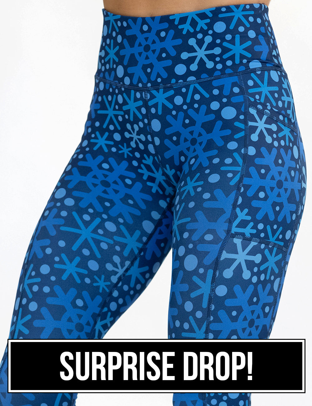 front of the blue snowflakes on a dark blue background leggings, surprise drop