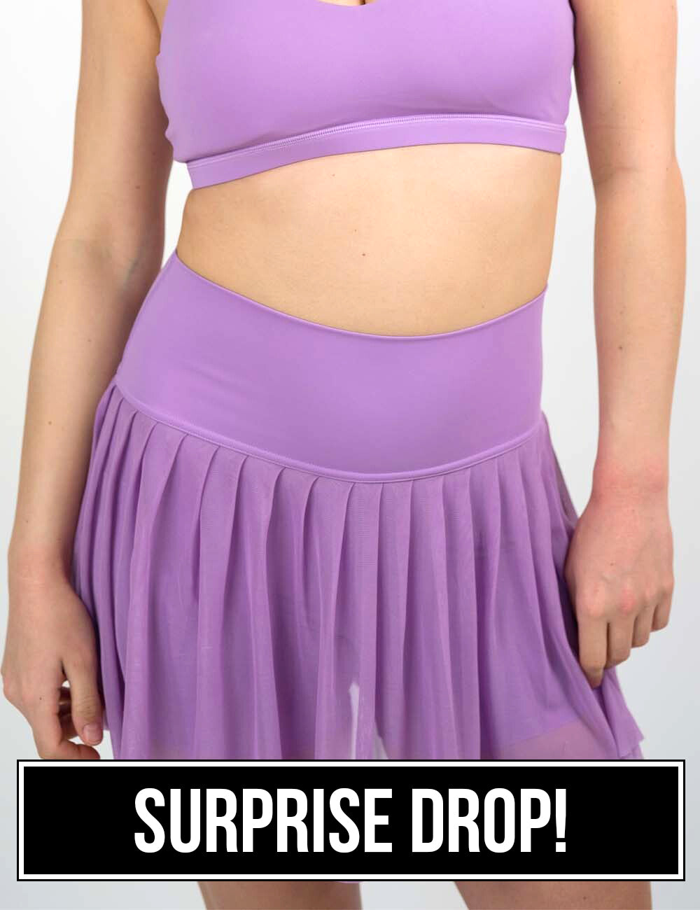 front of the sheer purple skirt against a white background, surprise drop