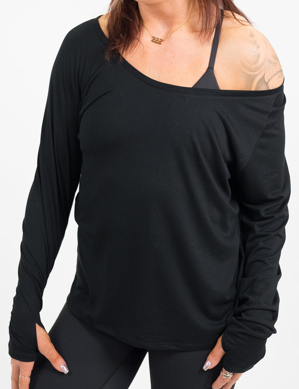front of the black slouchy long sleeve tee against a white background