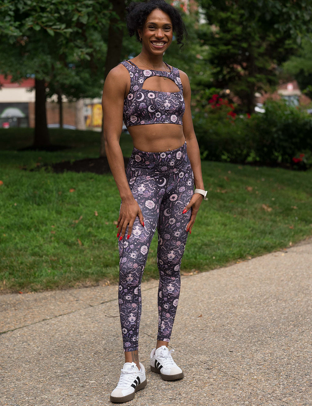 model wearing the purple medusa with flowers full length leggings and vista bra