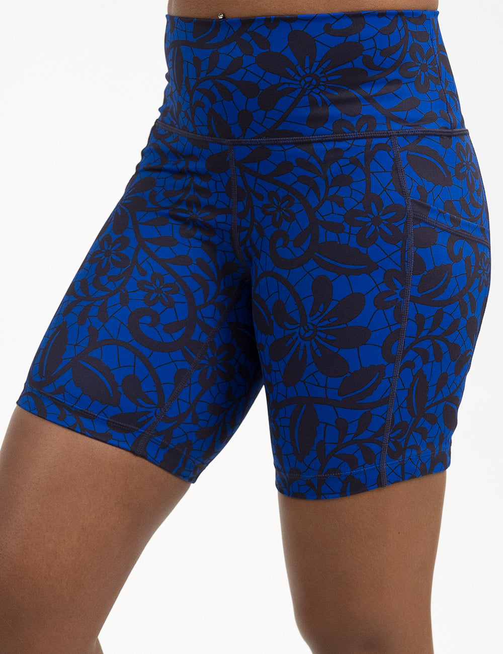 front of the 7 inch black floral against a dark blue background shorts against a white background