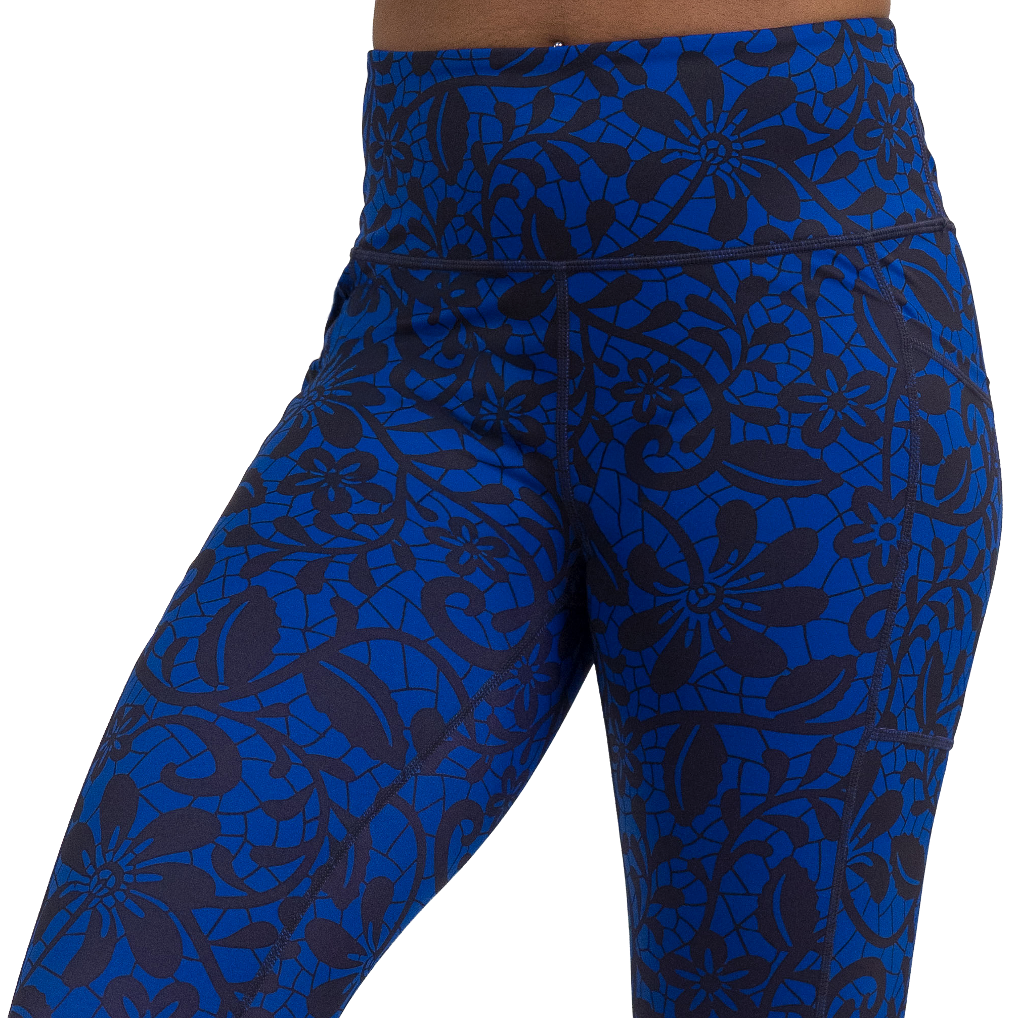 close up of black floral against a dark blue background pattern leggings against a white background
