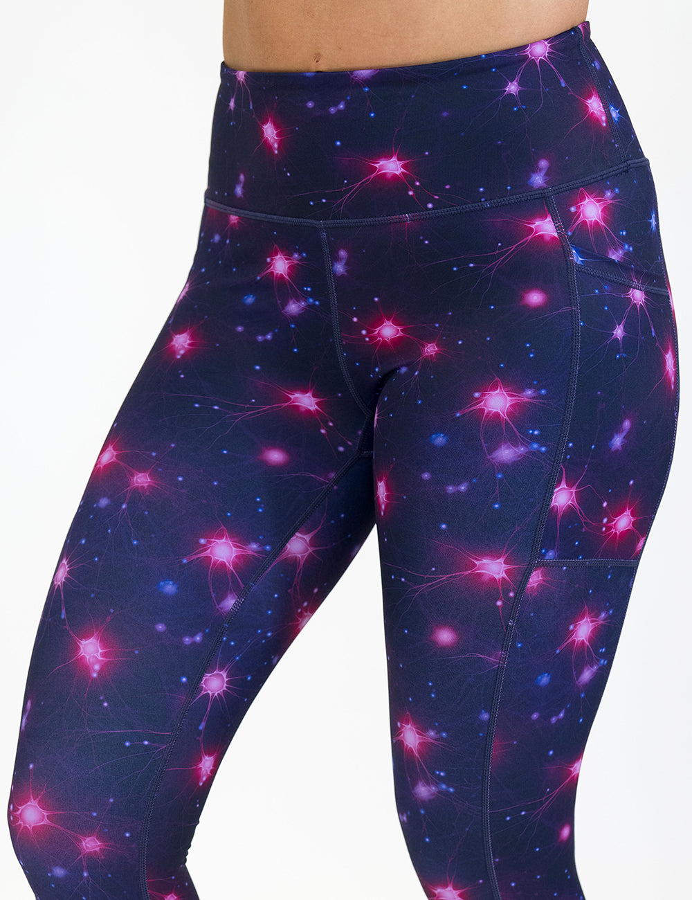 front of the leggings with a science pattern on them against a white background