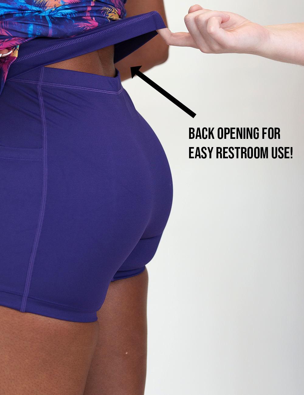 easy restroom use back opening for the colorful palm trees dress against a white background