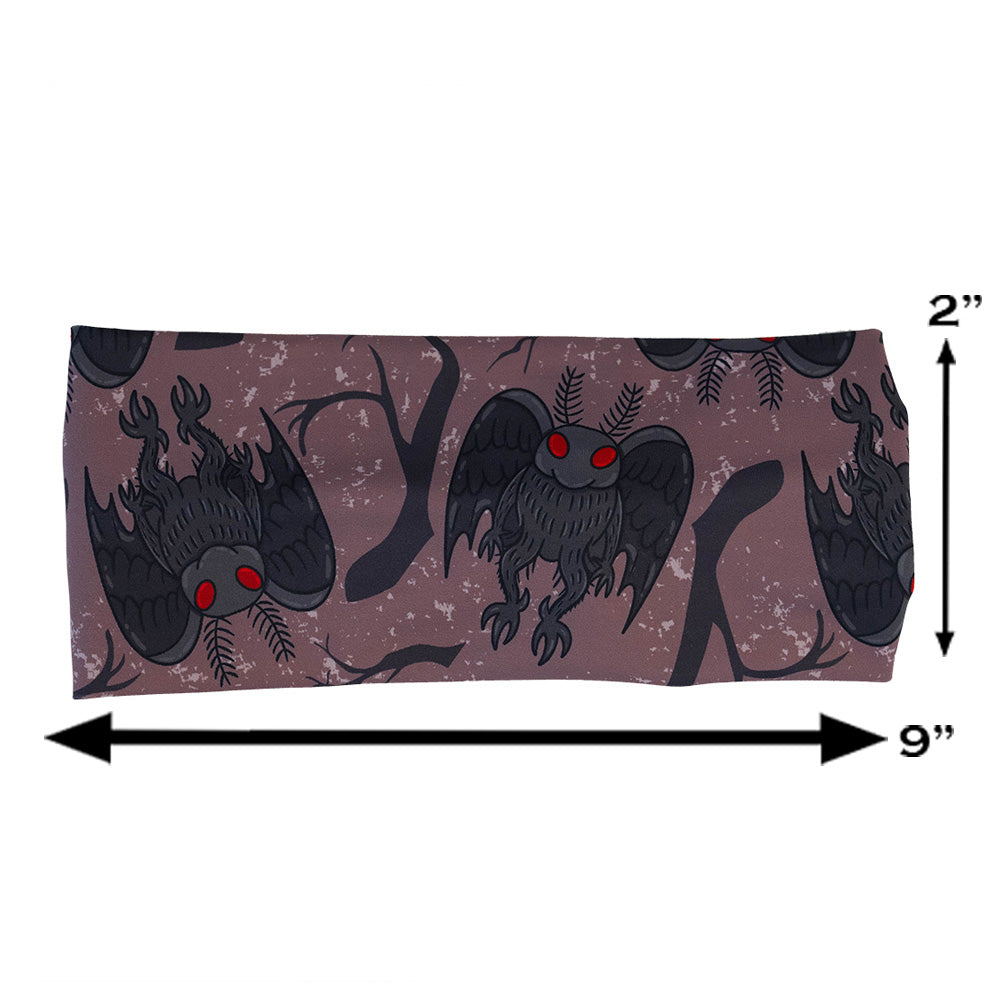 cartoon mothman print headband measured at 2 by 9 inches