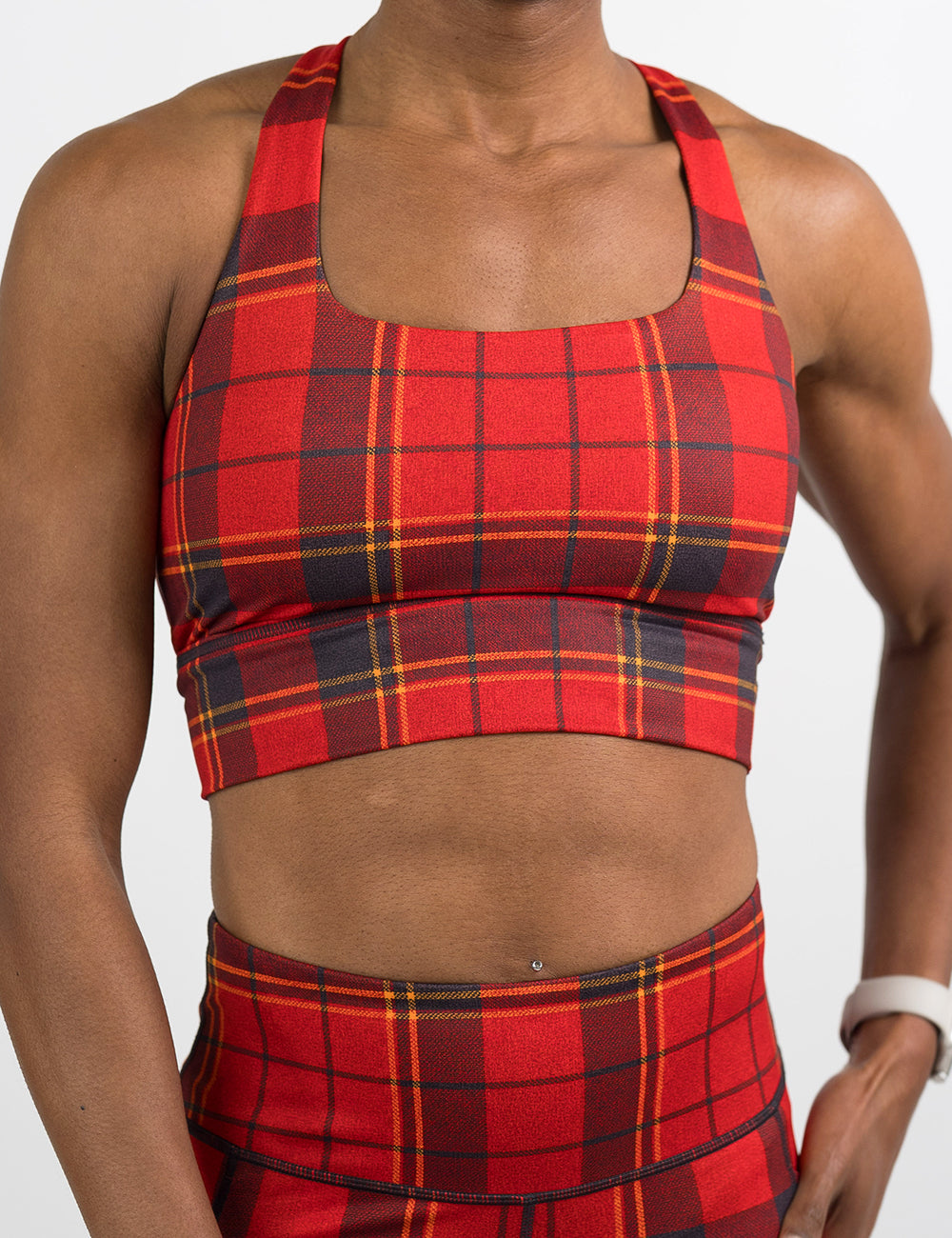 front of the red, dark red, and yellow plaid bra against a white background