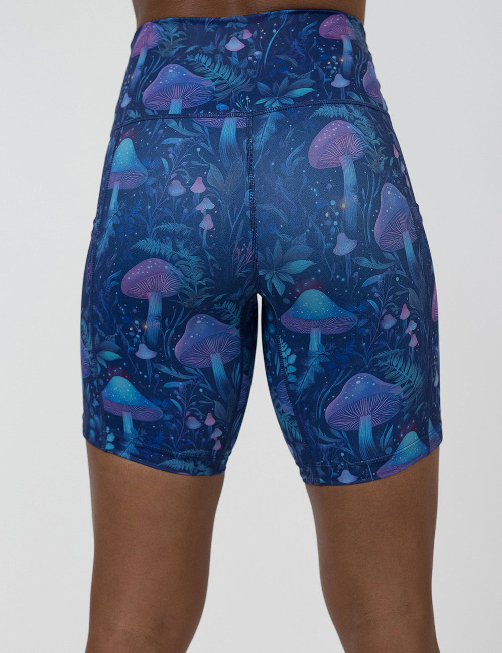 back of the 7 inch blue and purple mushroom and foliage design shorts against a white background