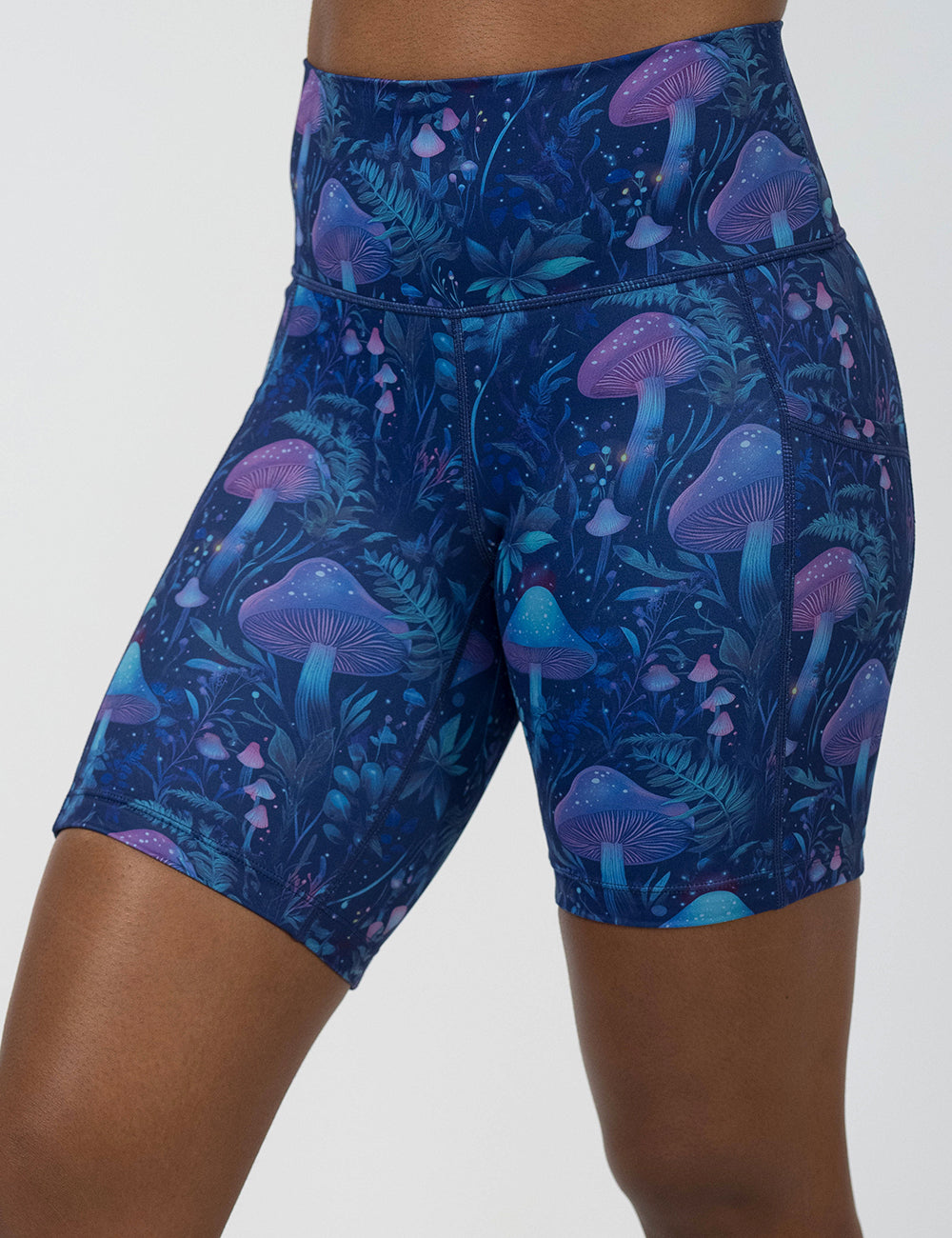 front of the 7 inch blue and purple mushroom and foliage design shorts against a white background