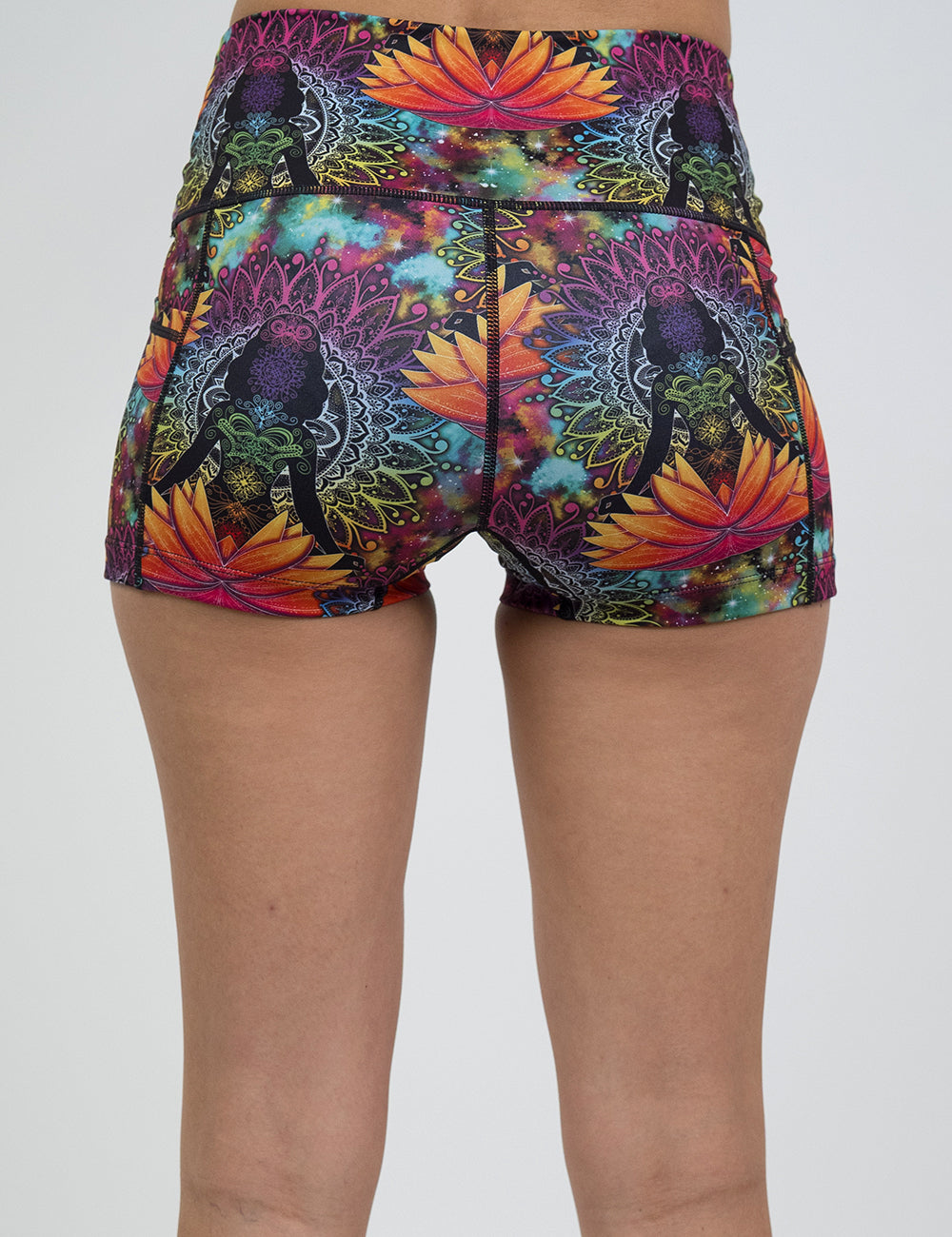 back of the 2.5 inch colorful yoga lotus flower shorts against a white background
