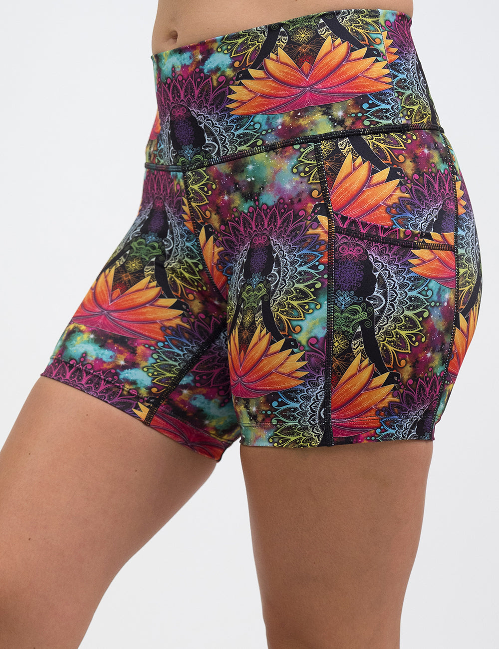 front of the 5 inch colorful yoga lotus flower shorts against a white backgroudn