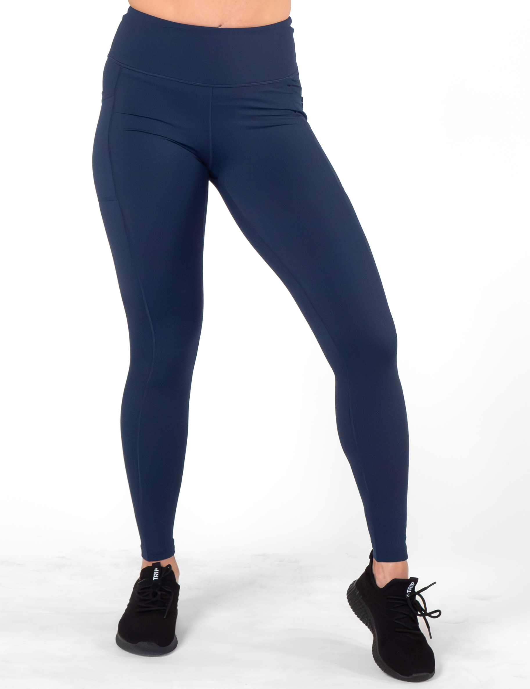 model wearing the full length solid navy blue leggings against a white background
