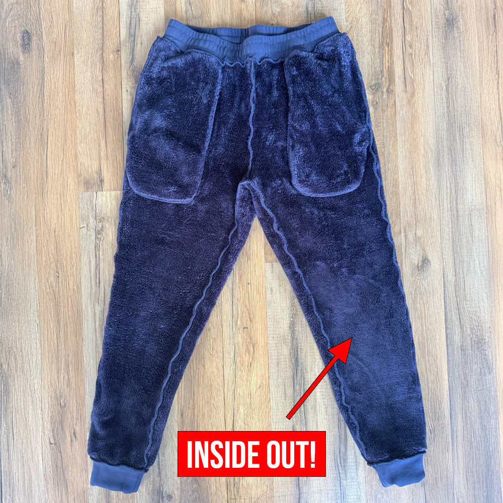 navy fleece lined rest day sweatpants flipped inside out to showcase fleece lining