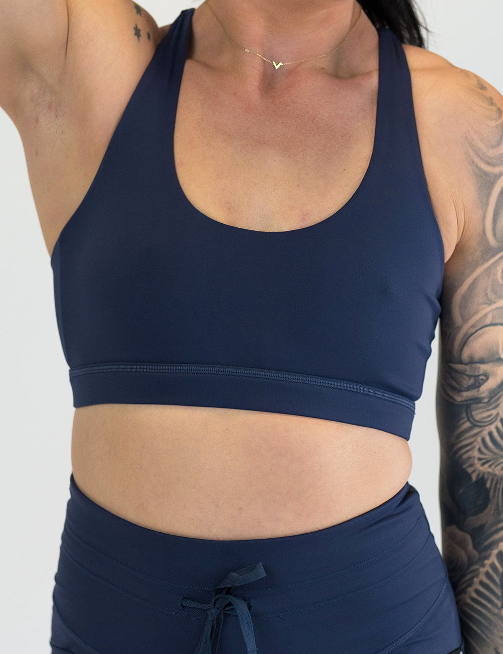 front of the navy blue sports bra