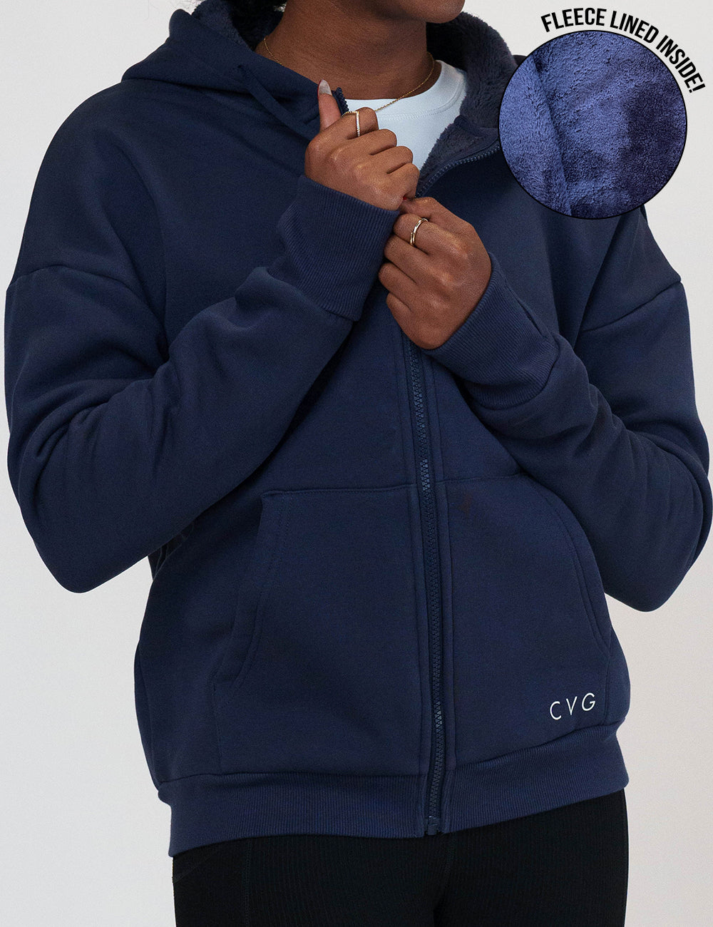 close up of the fleece inside of the navy blue fleece zip up