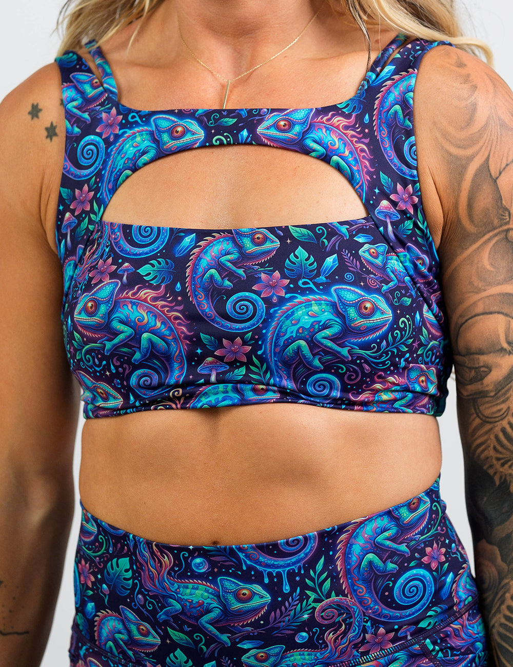 front of the orange, blue, and red chameleons sports bra against a white background