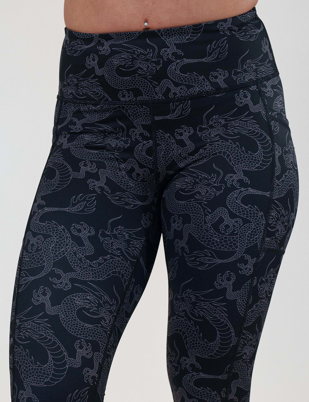 dragon patterned leggings against a white background