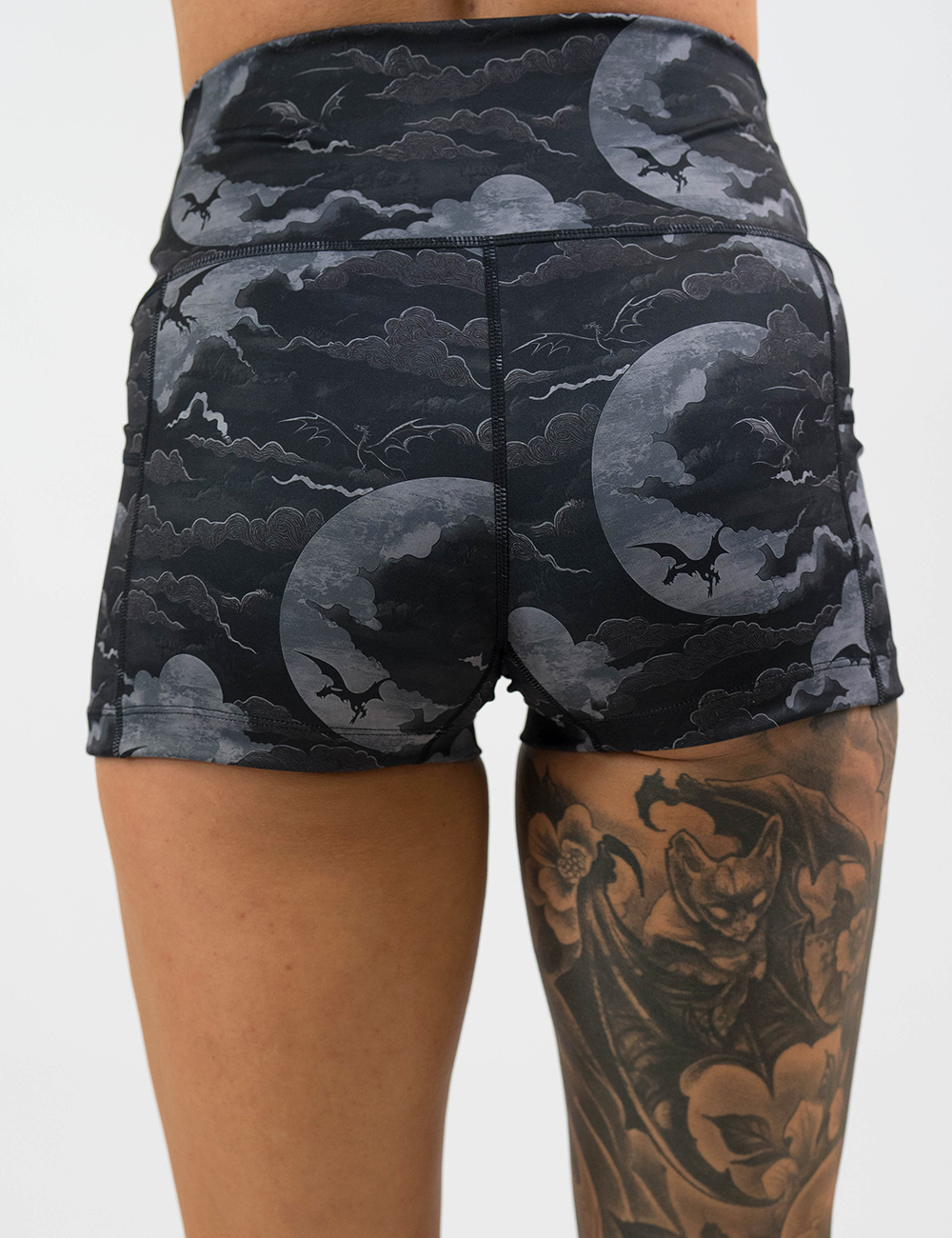 back of the dark dragon against moonlit clouds pattern 2.5 inch shorts against a white background