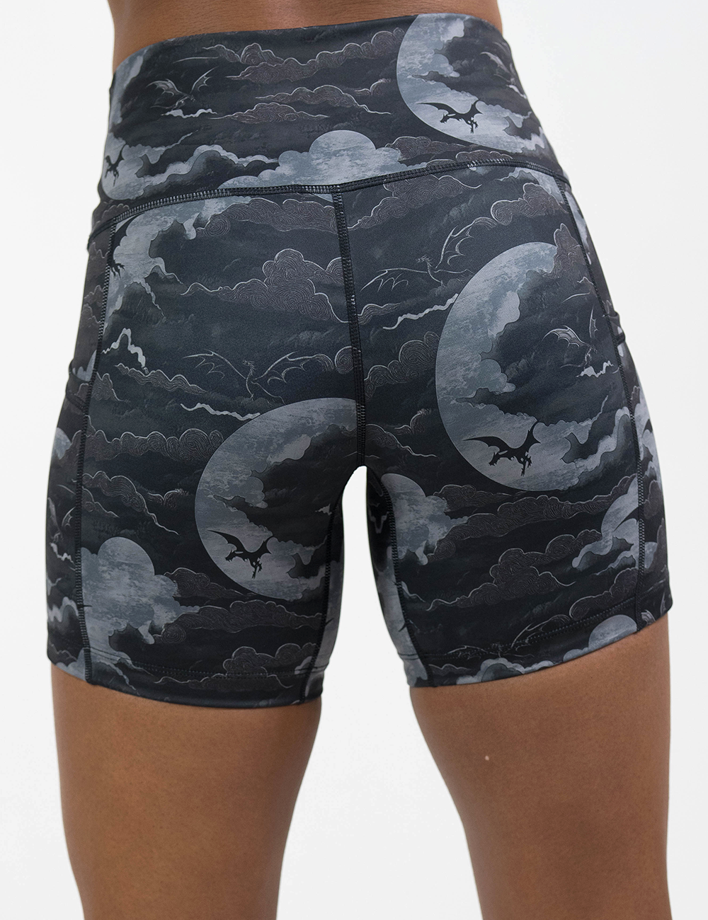 back of the 5 inch dark dragon against moonlit clouds pattern shorts against a white background