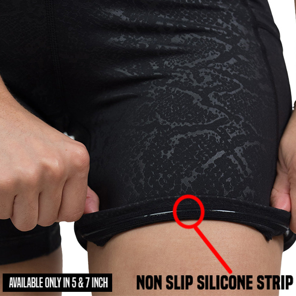 rolled up close up of the black snake print shorts non slip silicone strip which is only found in the 5 and 7 inch inseam shorts