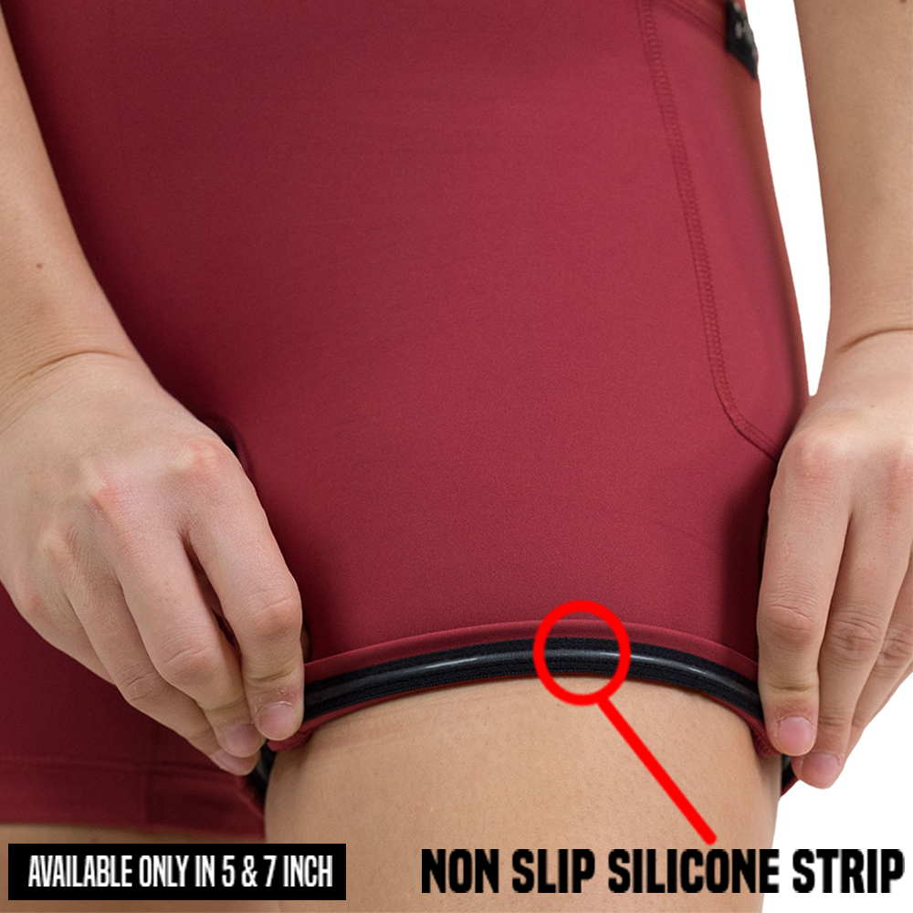 close up of rolled up garnet red shorts to show the non slip silicone strip found inside the 5 and 7 inch omni garnet red shorts