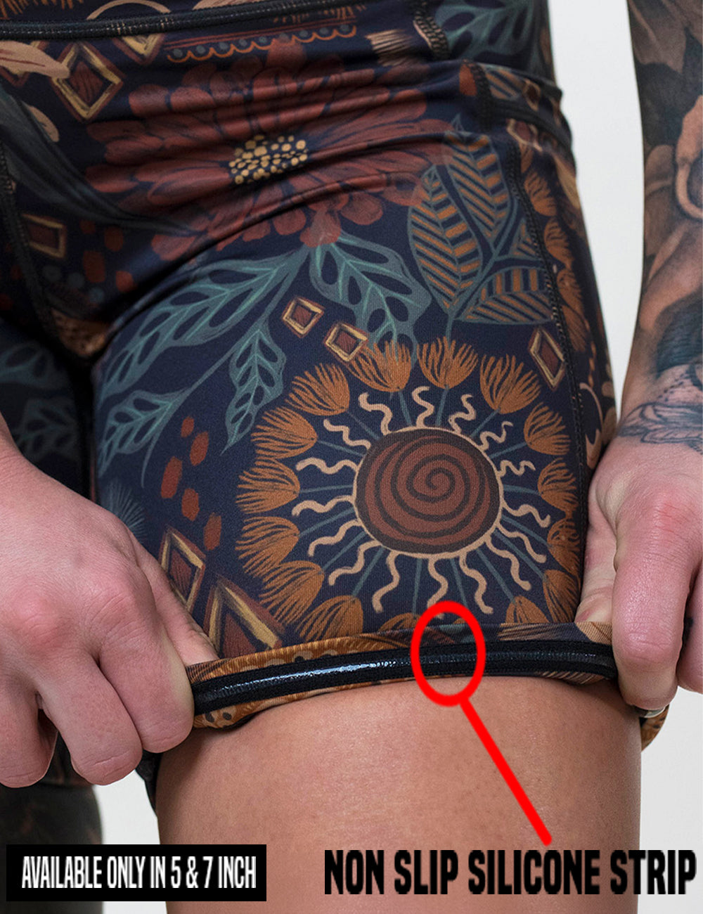 close up of the paisley flowers shorts being rolled up to show the non slip silicone strip found in the 5 and 7 inch shorts