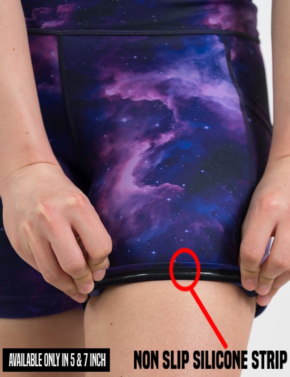 close up of the purple space patterned shorts being rolled up to show the non slip silicone strip found in the 5 and 7 inch shorts