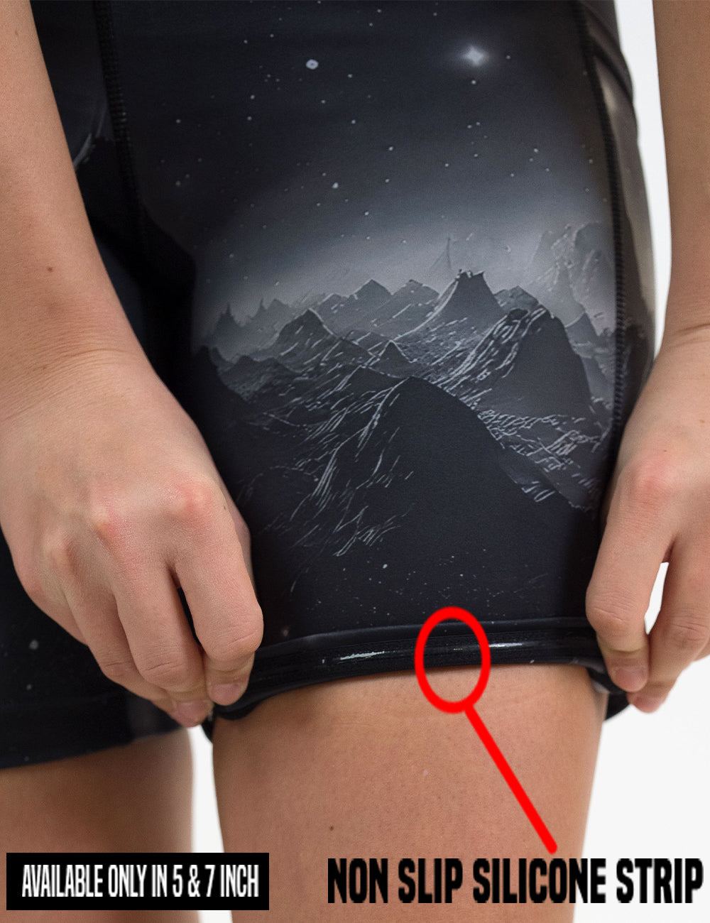close up of the dark mountains in space shorts pulled up to show the non slip silicone strip lining found in the 5 and 7 inch shorts