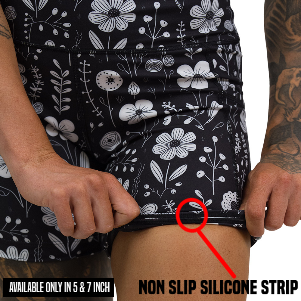 close up of black and white floral shorts non slip silicone strip, found in the 5 and 7 inch shorts