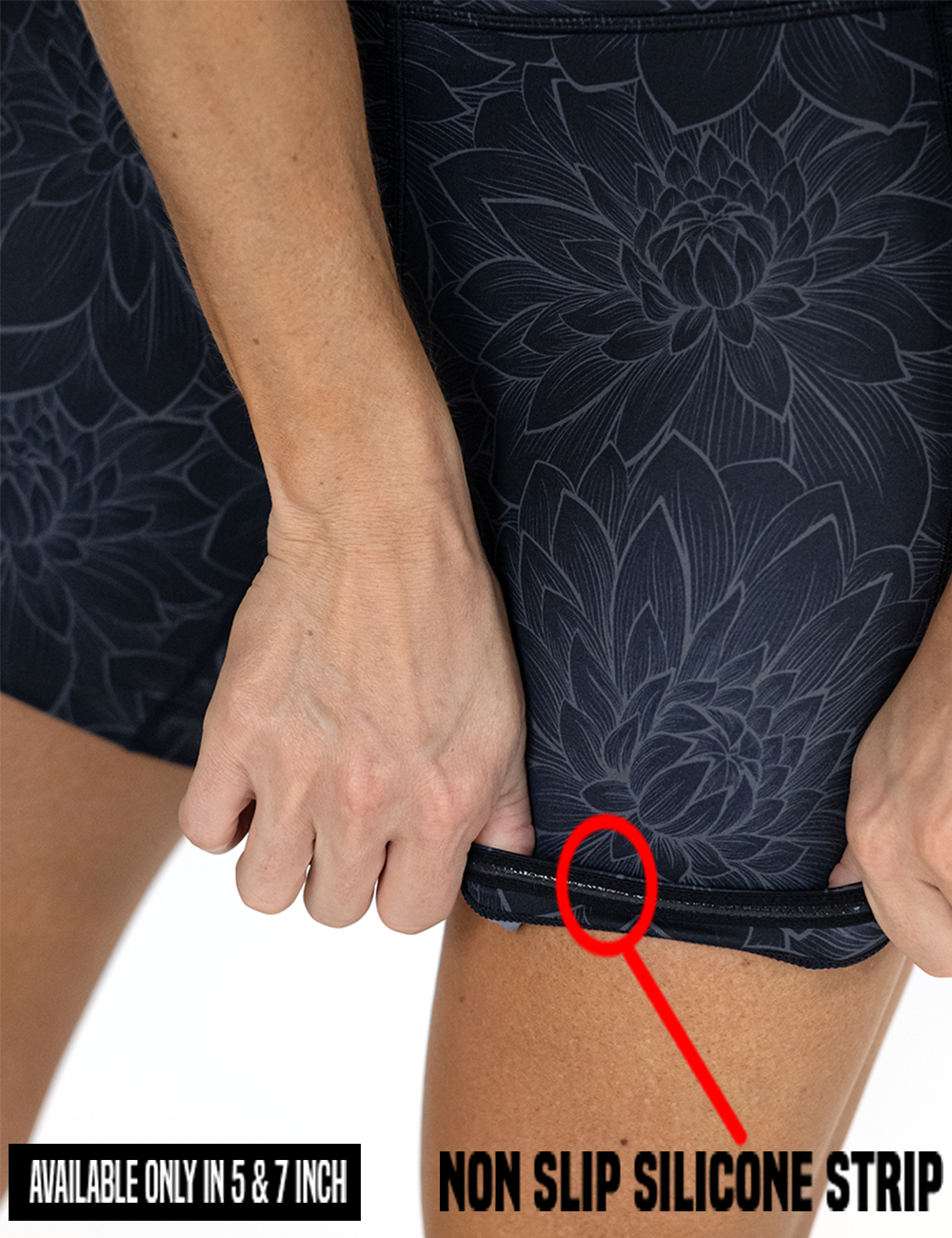 close up showing the etched lotus flower against a black background shorts rolled up to show the non slip silicone strip found in the 5 and 7 inch inseam lengths