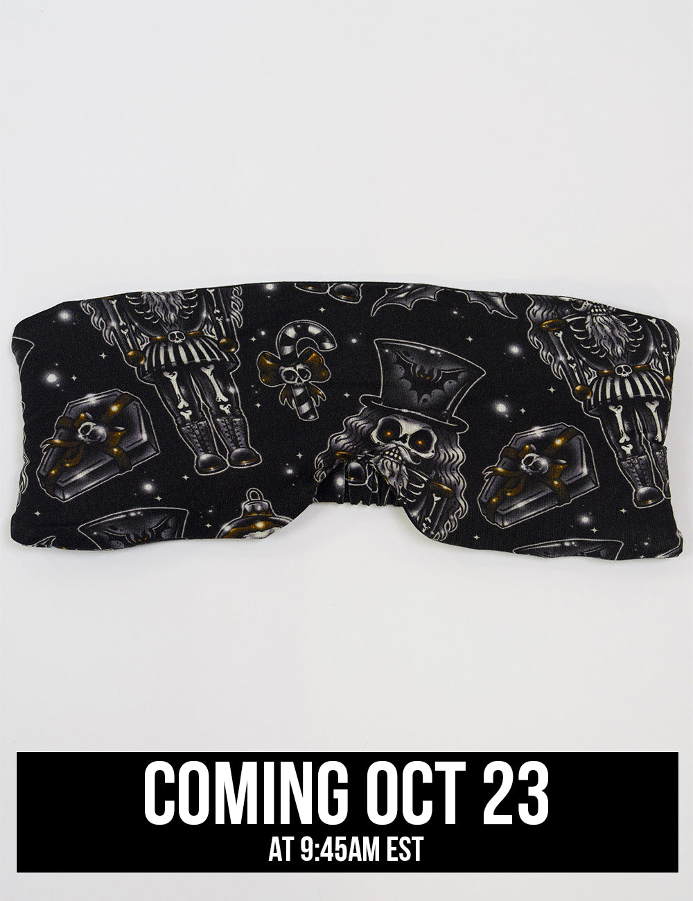 front of the black nutcrackers, mistle toe, and Christmas ornaments eye mask, coming October 23