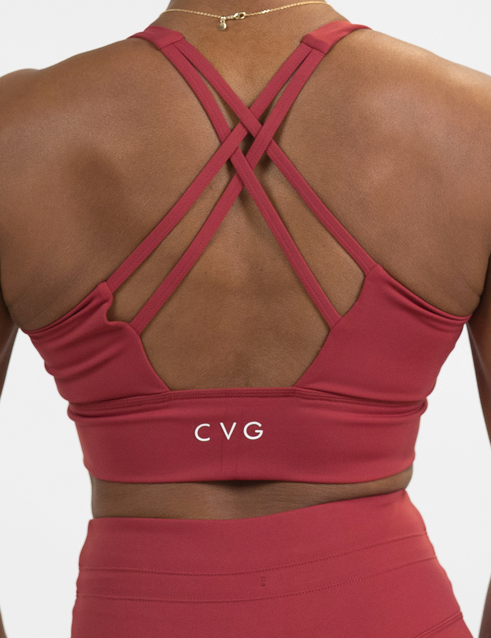 back of the omni solid red longline bra against a white background