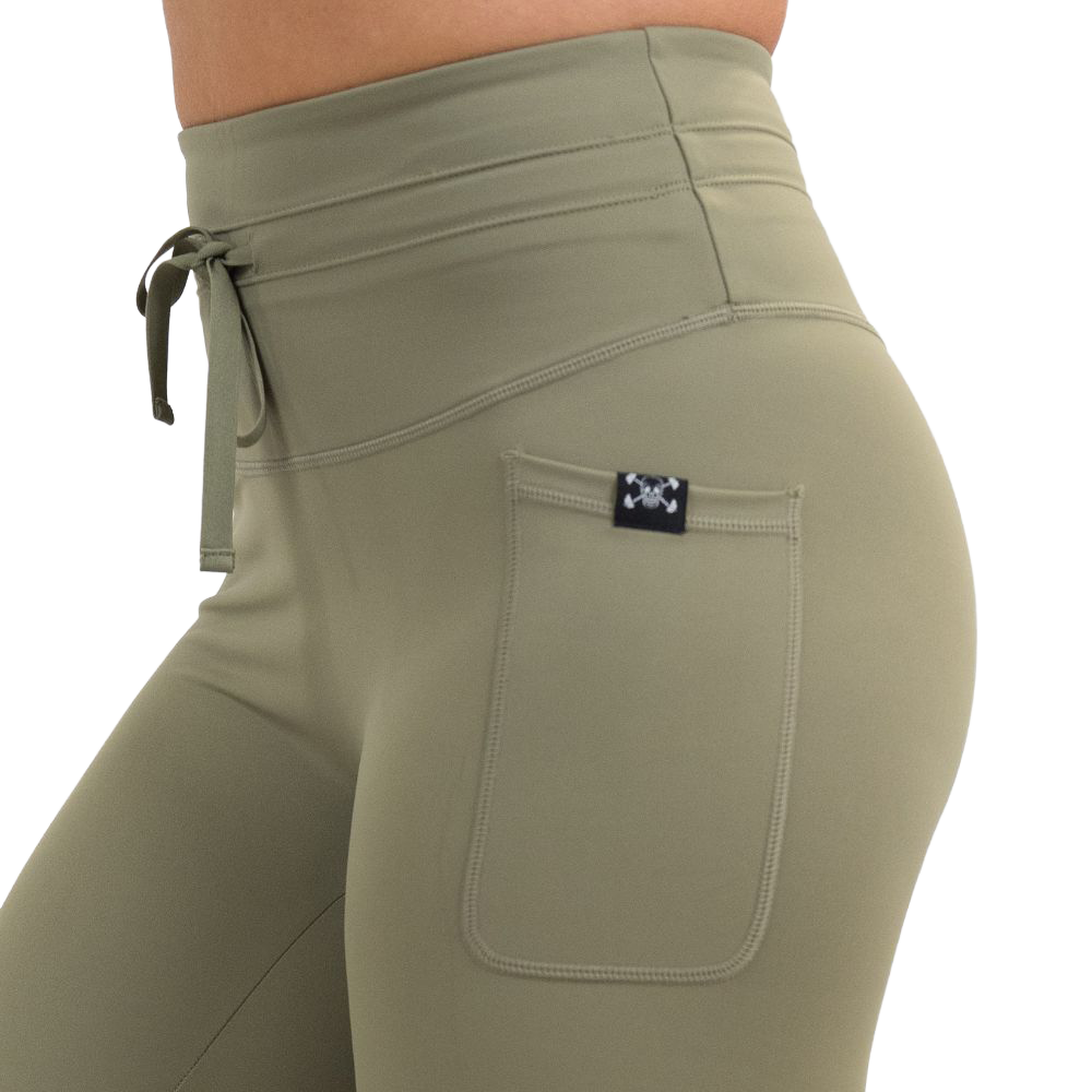 close up of the omni green tea leggings against a white background