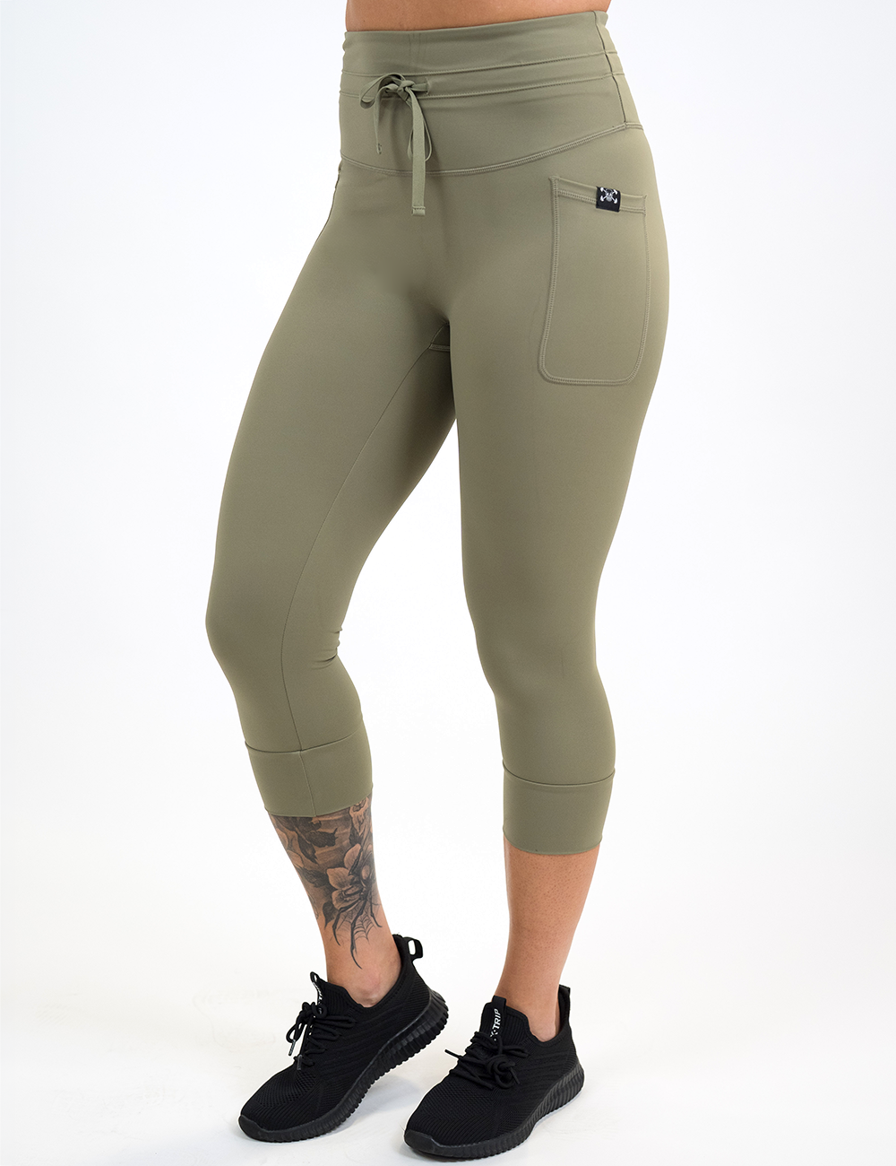 front of the green drawstring capri leggings against a white background