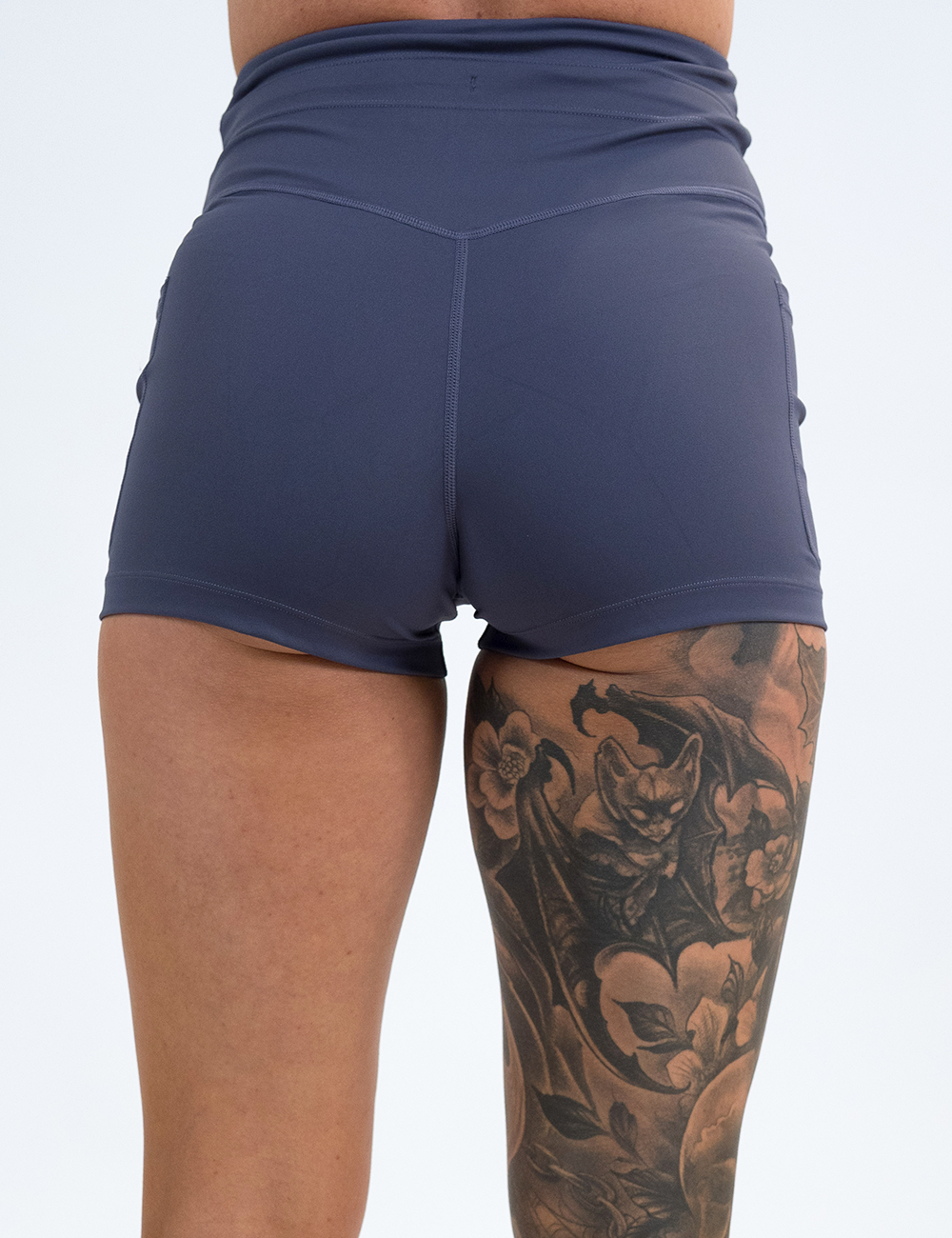 back of the 2.5 inch omni light purple shorts against a white background