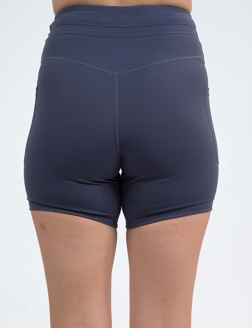 back of the omni light purple 5 inch shorts against a white background