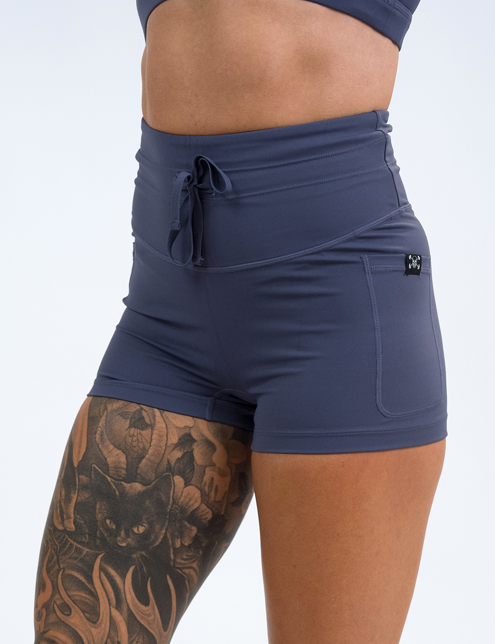 front of the 2.5 inch light purple omni shorts against a white background
