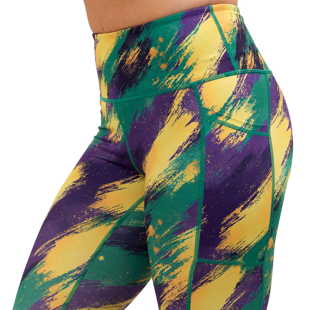 Mardi Gras themed leggings that are purple yellow and green
