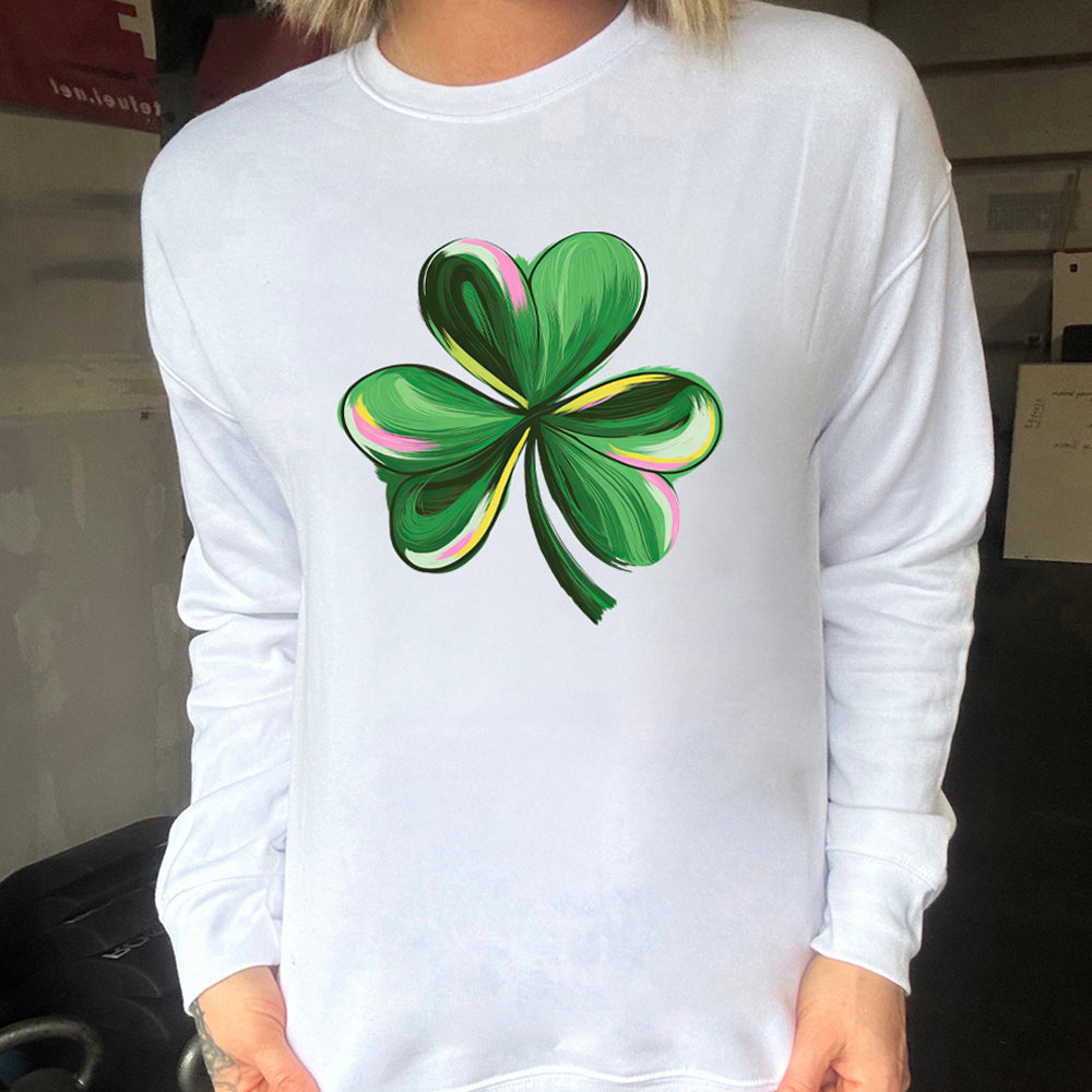 white crewneck with a painted shamrock graphic on it