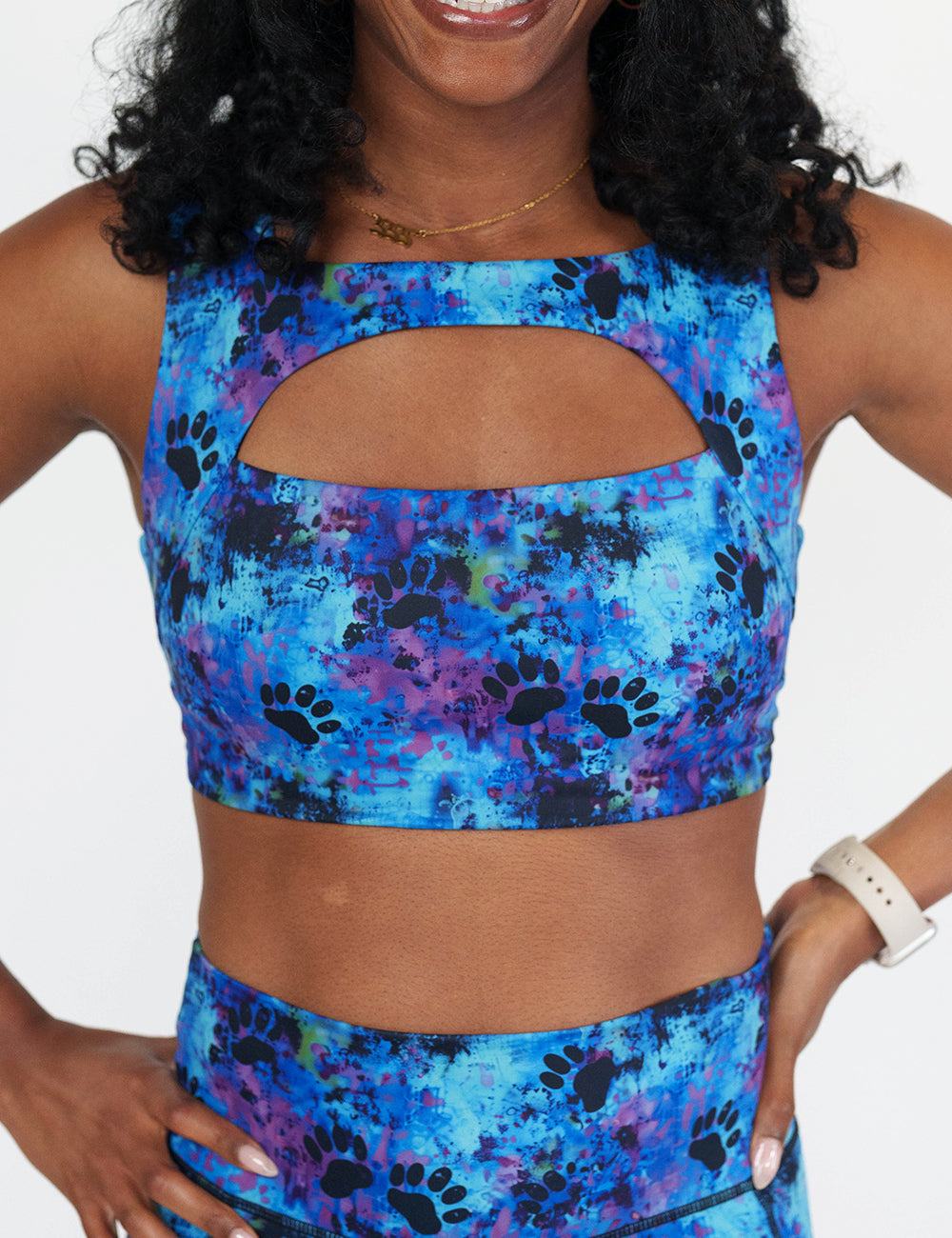 front of the blue and purple tie dye bra with black paw prints all over