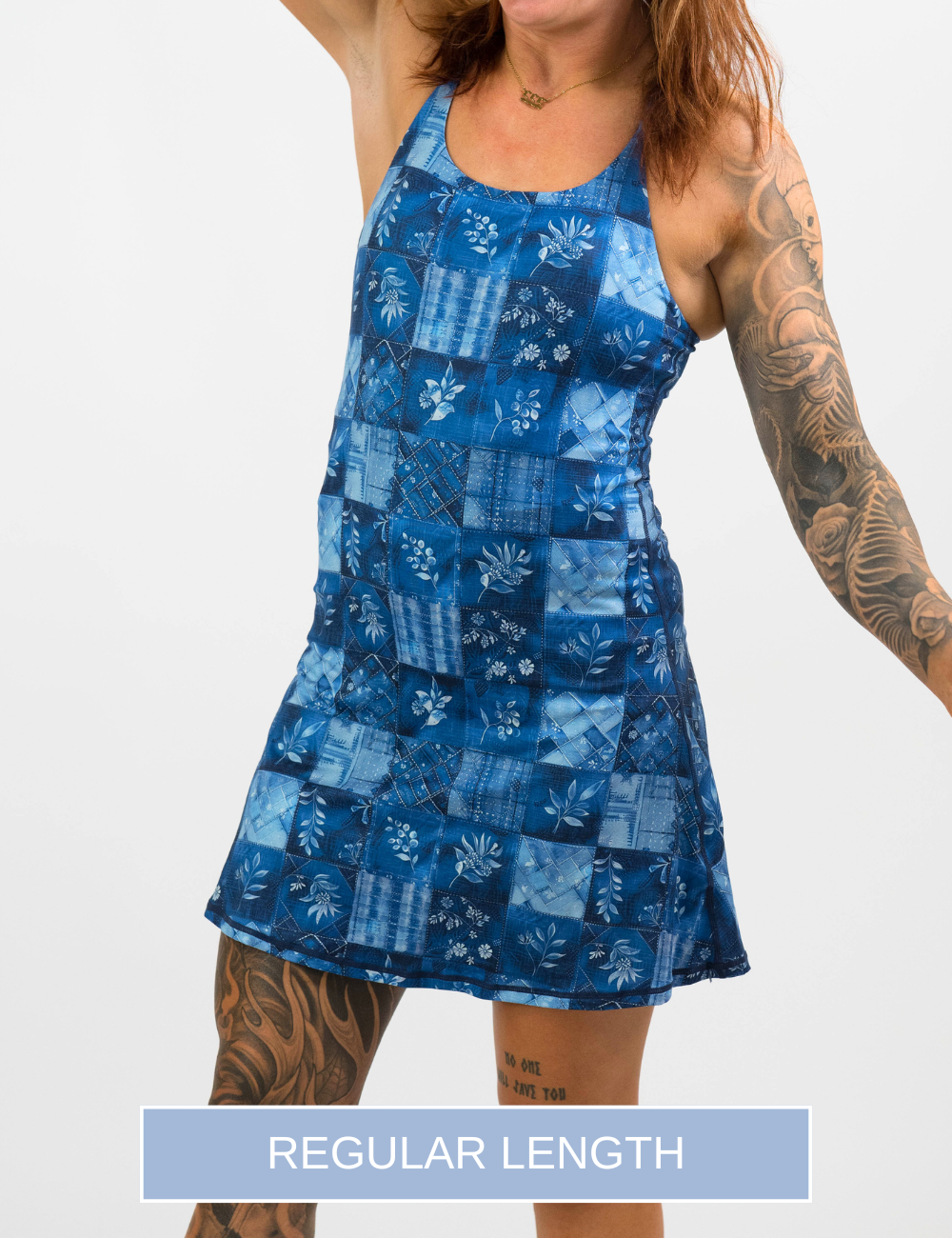 front of the regular length blue patchwork flowers dress against a white background
