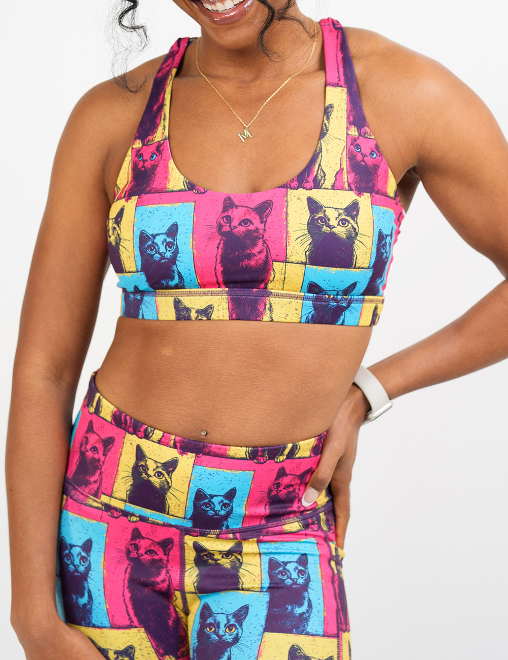 front of the red, blue, and yellow cat patchwork print butterfly back bra against a white background