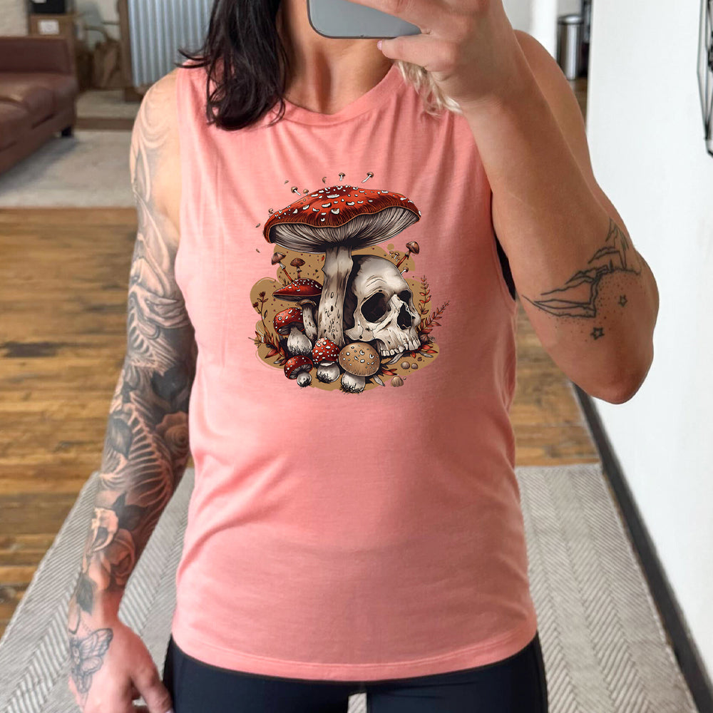 peach muscle tank with a mushroom skull graphic in the middle