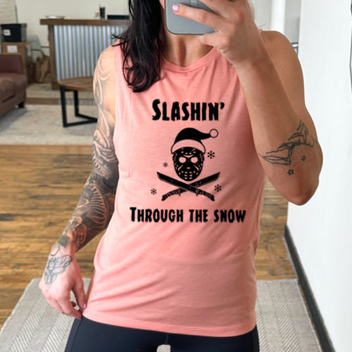 model wearing peach muscle tank with black slashin through the snow design on it