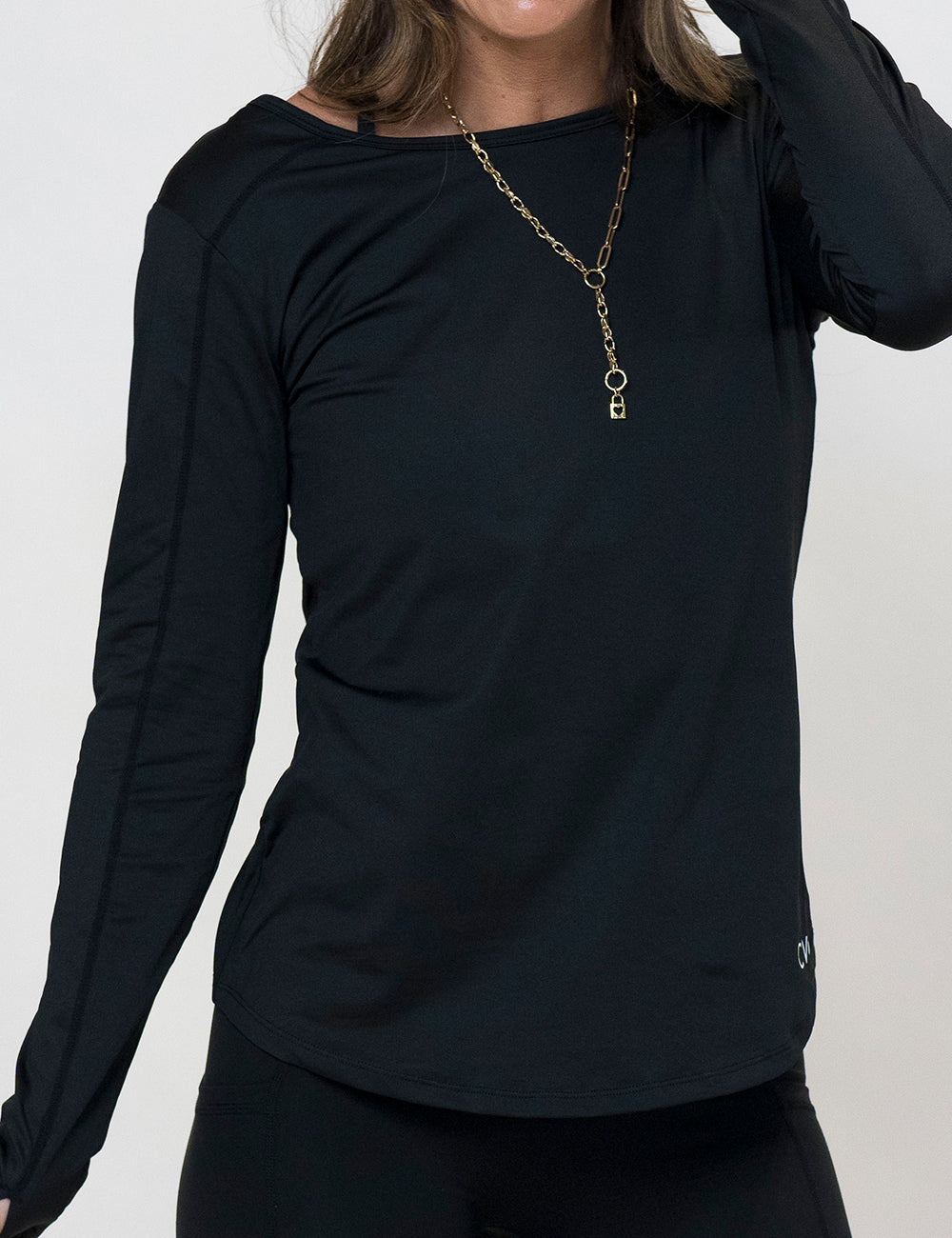 model wearing a black long sleeve shirt