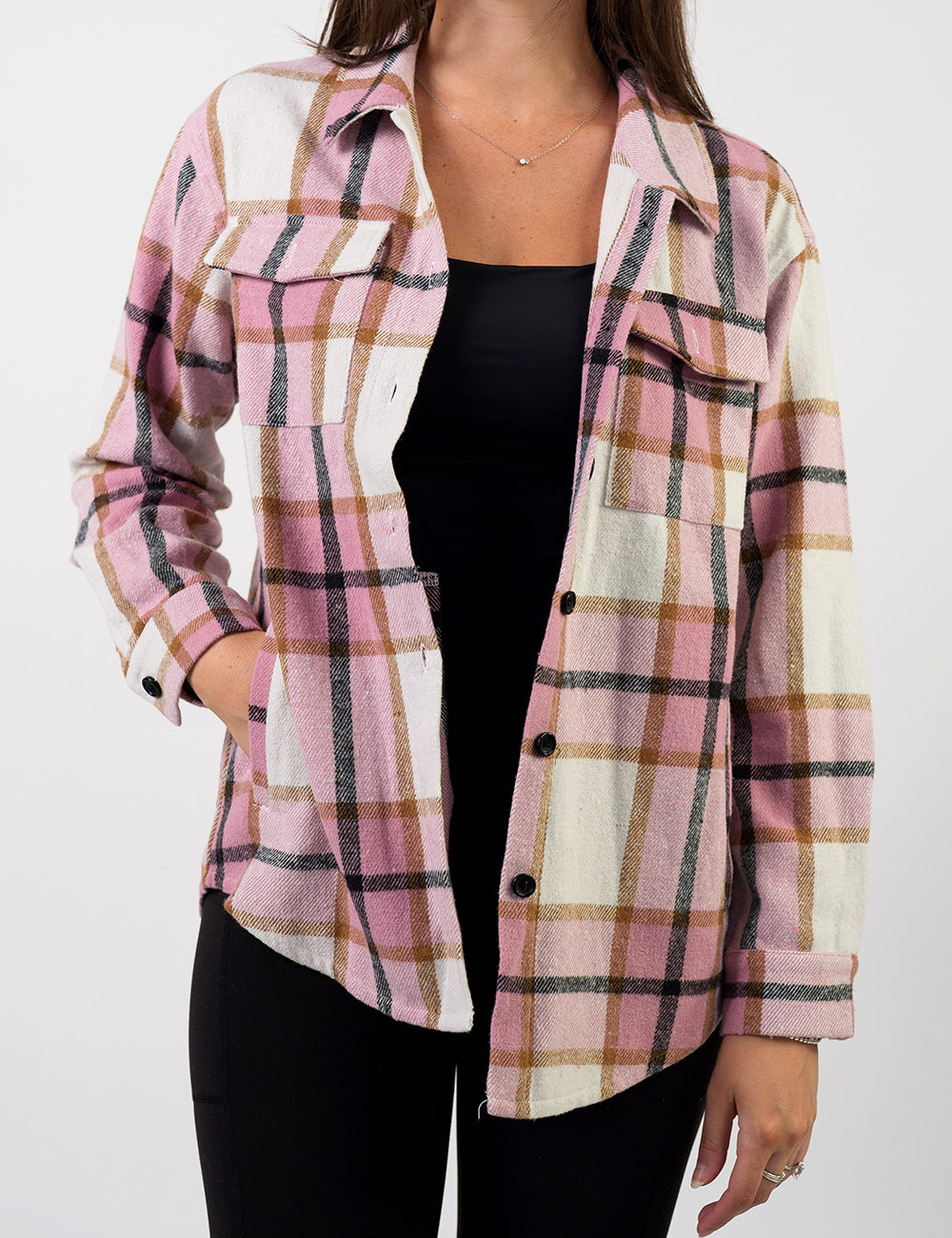 front of the pink, black, white, and brown plaid shacket against a white background