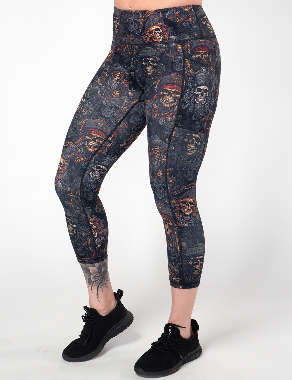model wearing the capri pirates skulls leggings against a white background