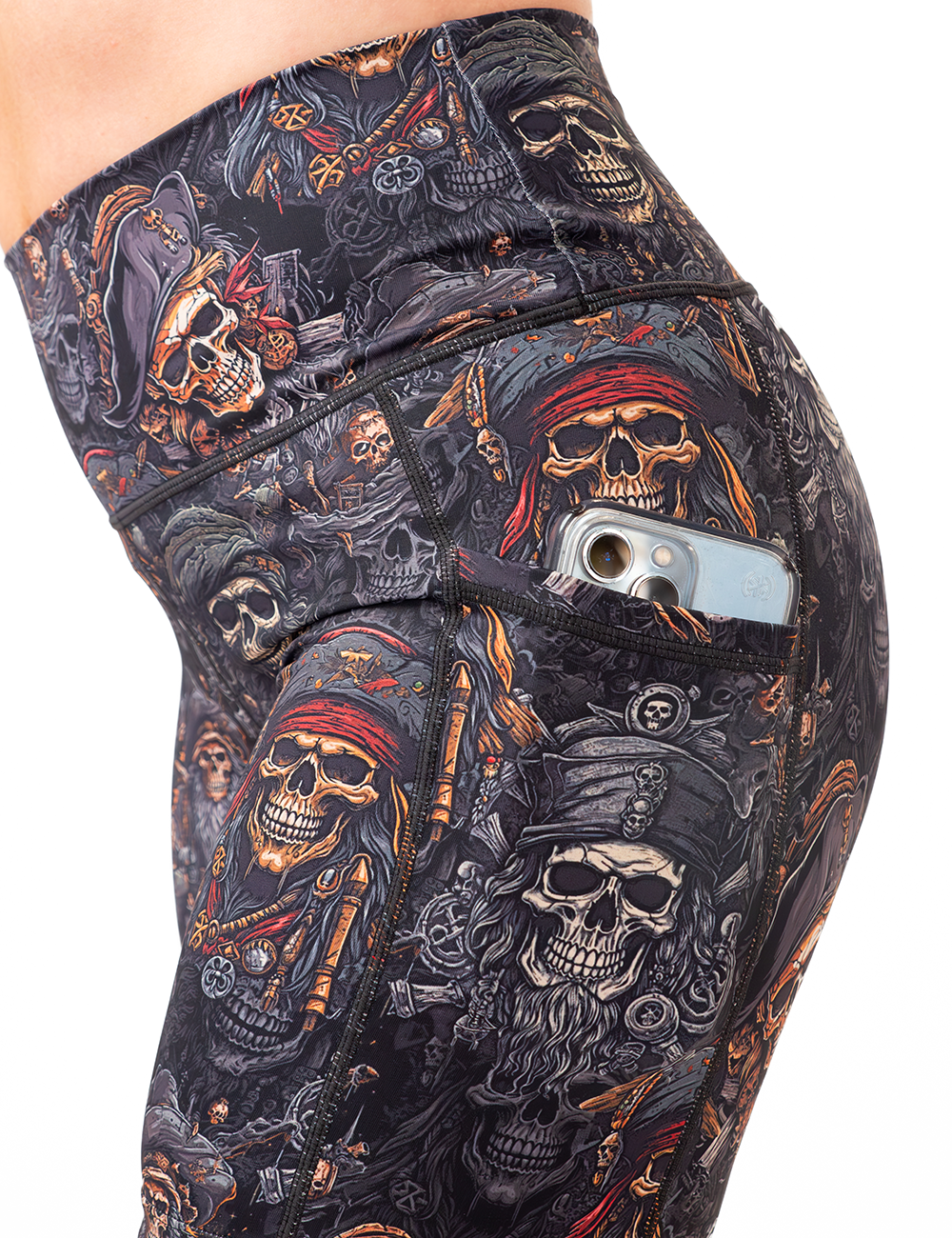 close up of the pirates skulls shorts with a phone in the pocket