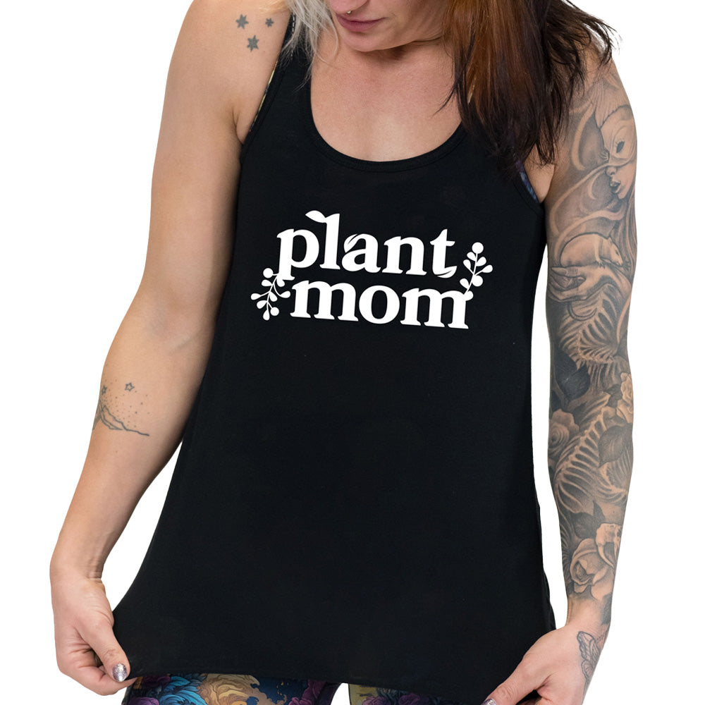 Model wearing black colored flowy tank with a plant graphic on it that says "Plant Mom"